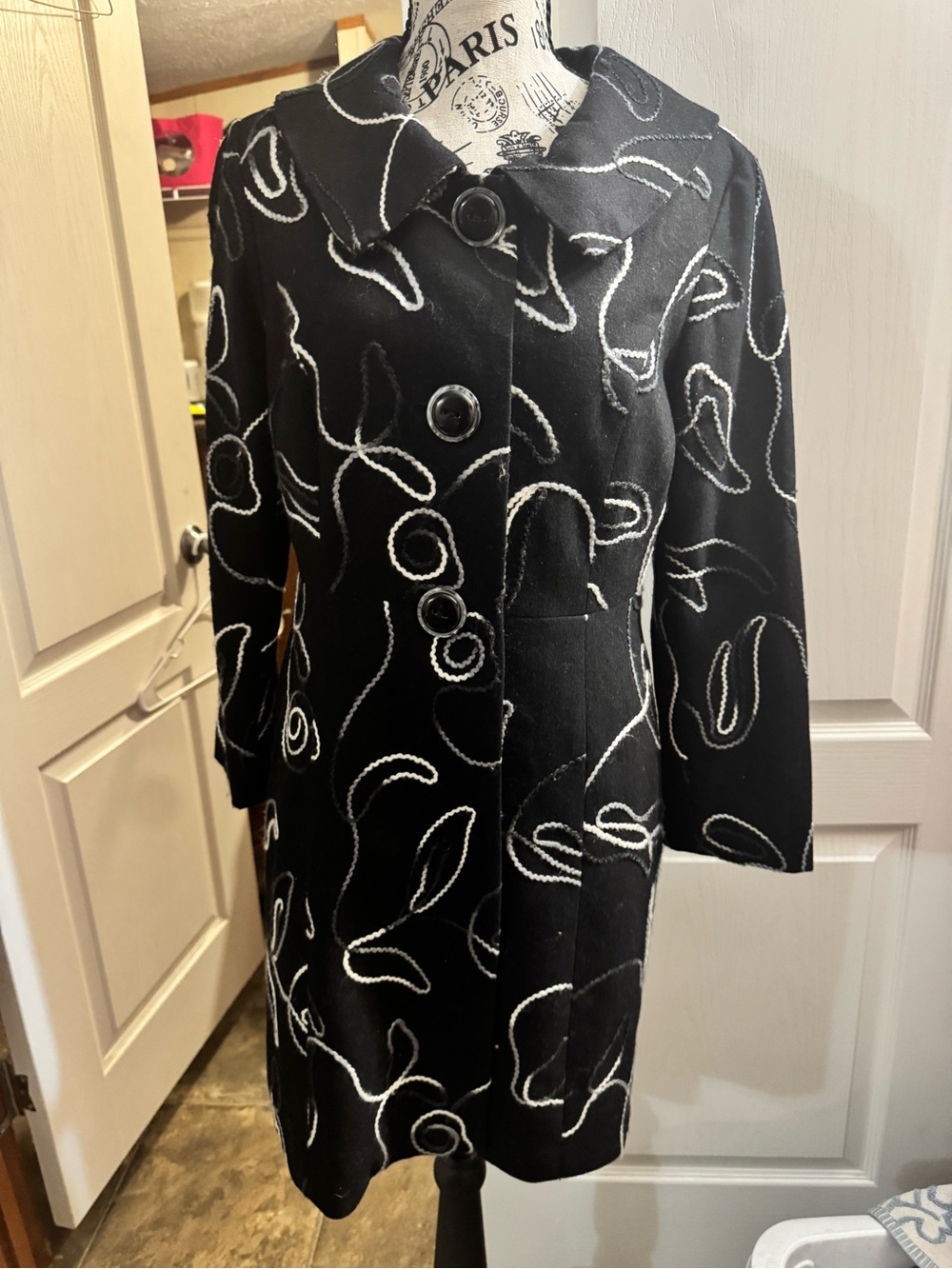 Harold's Black Trench Coat with White Embroidered Swirls